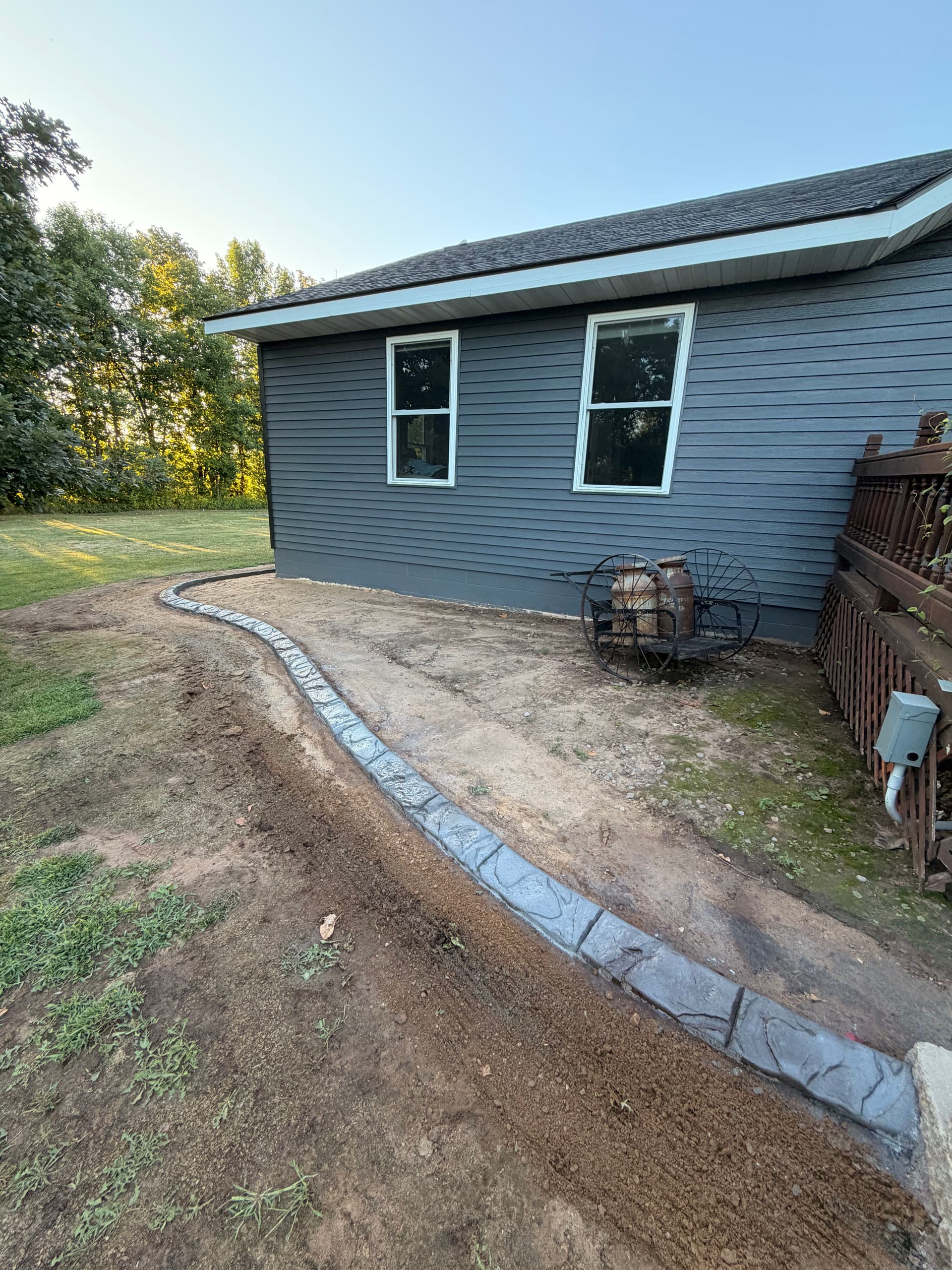 Concrete Curbing Wraps a Pierz Minnesota Property With Clean Edges image