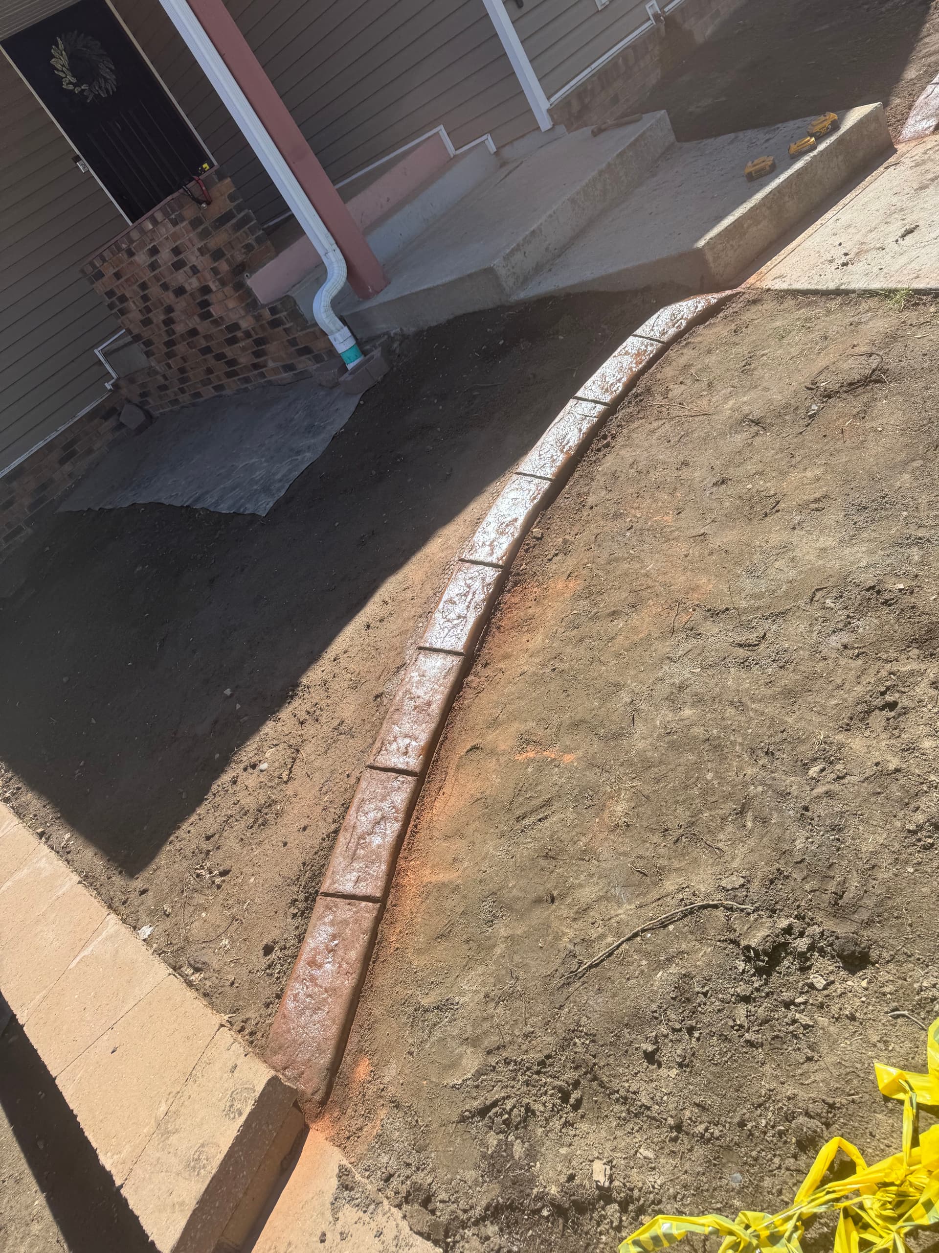 Gallery photos for Concrete Curbing with Terra Cotta and Walnut Blend in Buffalo MN: Image #1