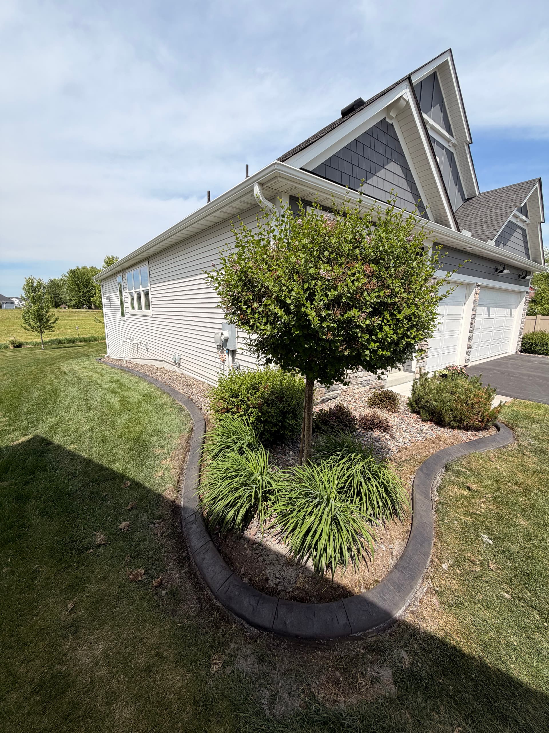 Gallery photos for Concrete Curbing Upgrade Gives St. Michael Home Sharp, Clean Edges: Image #1