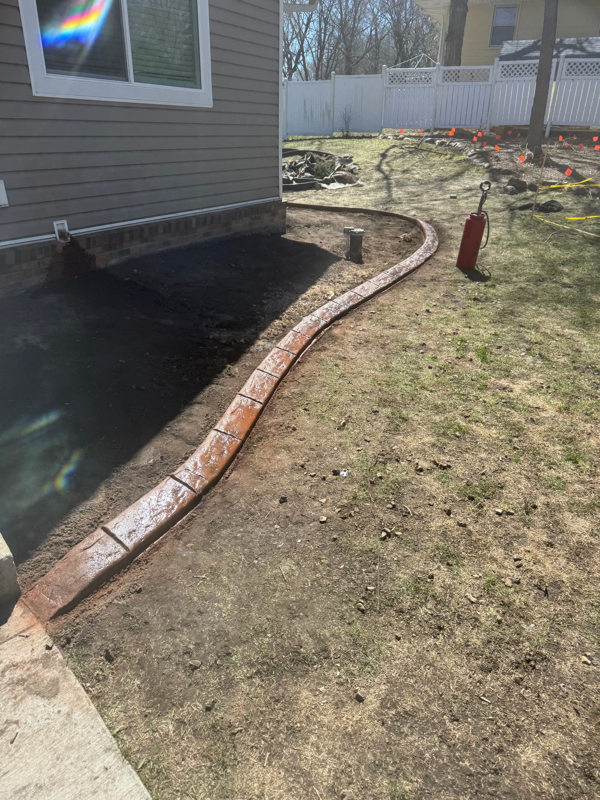 Concrete Curbing with Terra Cotta and Walnut Blend in Buffalo MN image