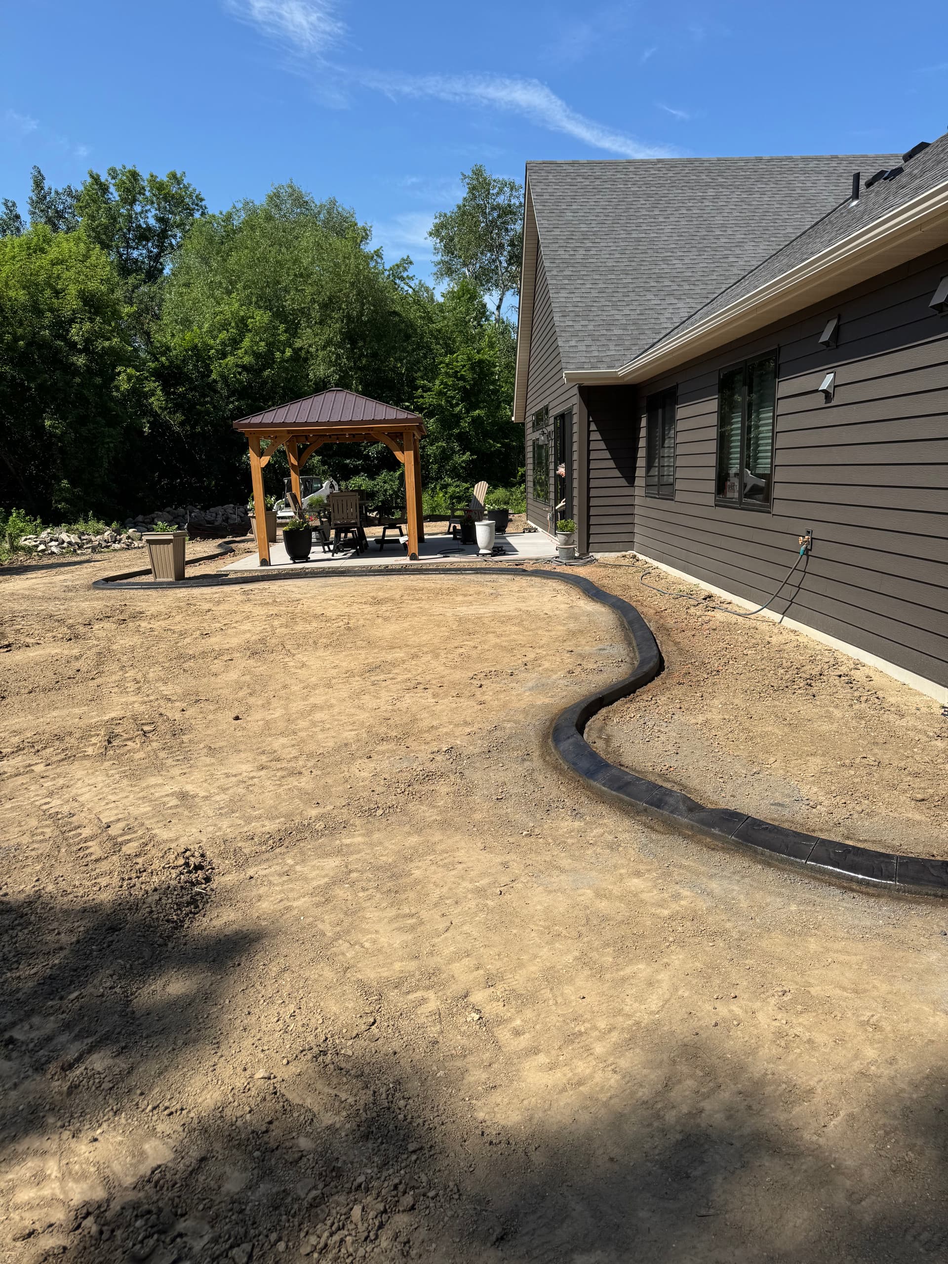 Gallery photos for Concrete Curbing With a Deep Charcoal Slate Stamp in Rogers: Image #5