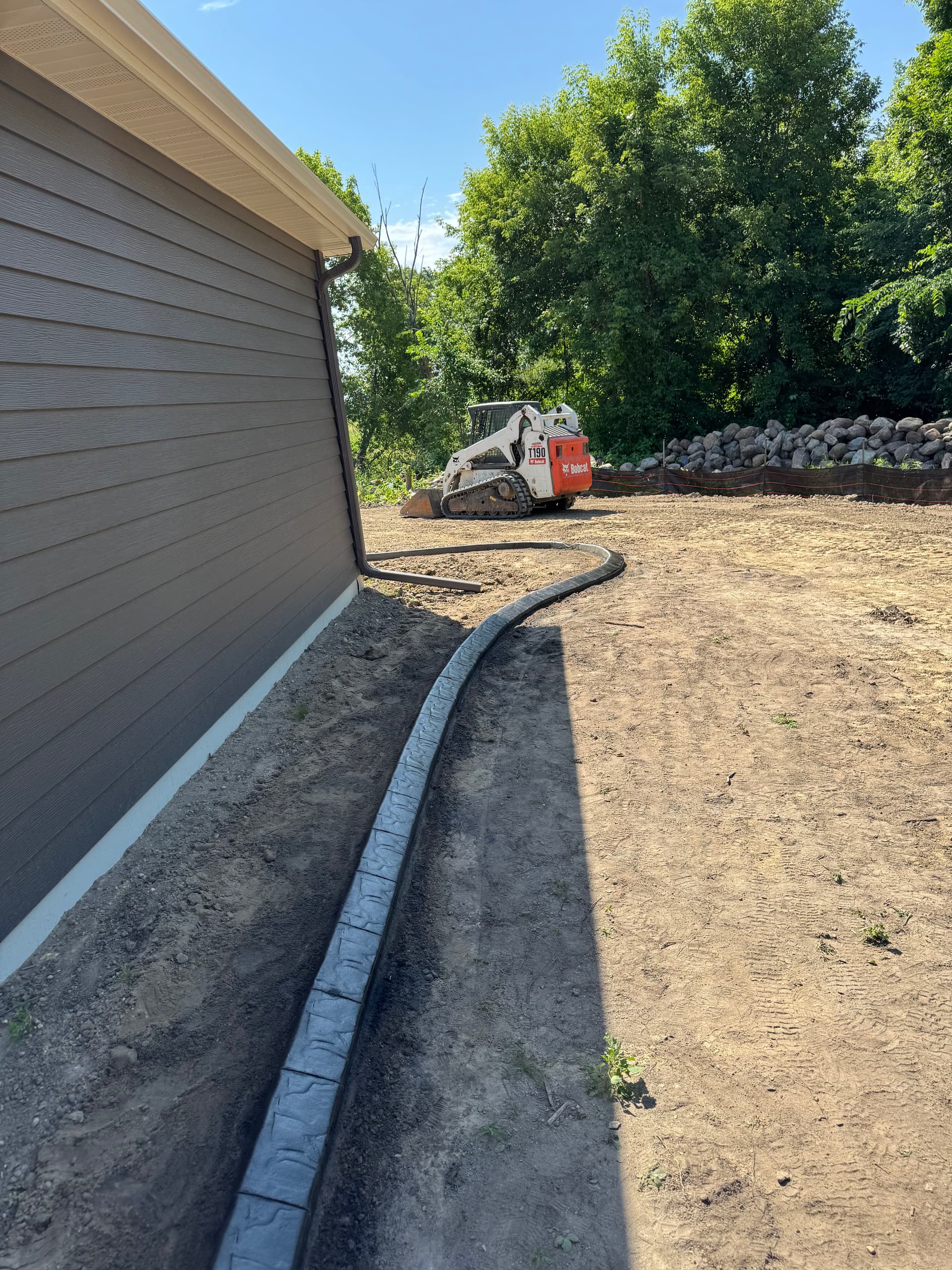 Gallery photos for Concrete Curbing With a Deep Charcoal Slate Stamp in Rogers: Image #6
