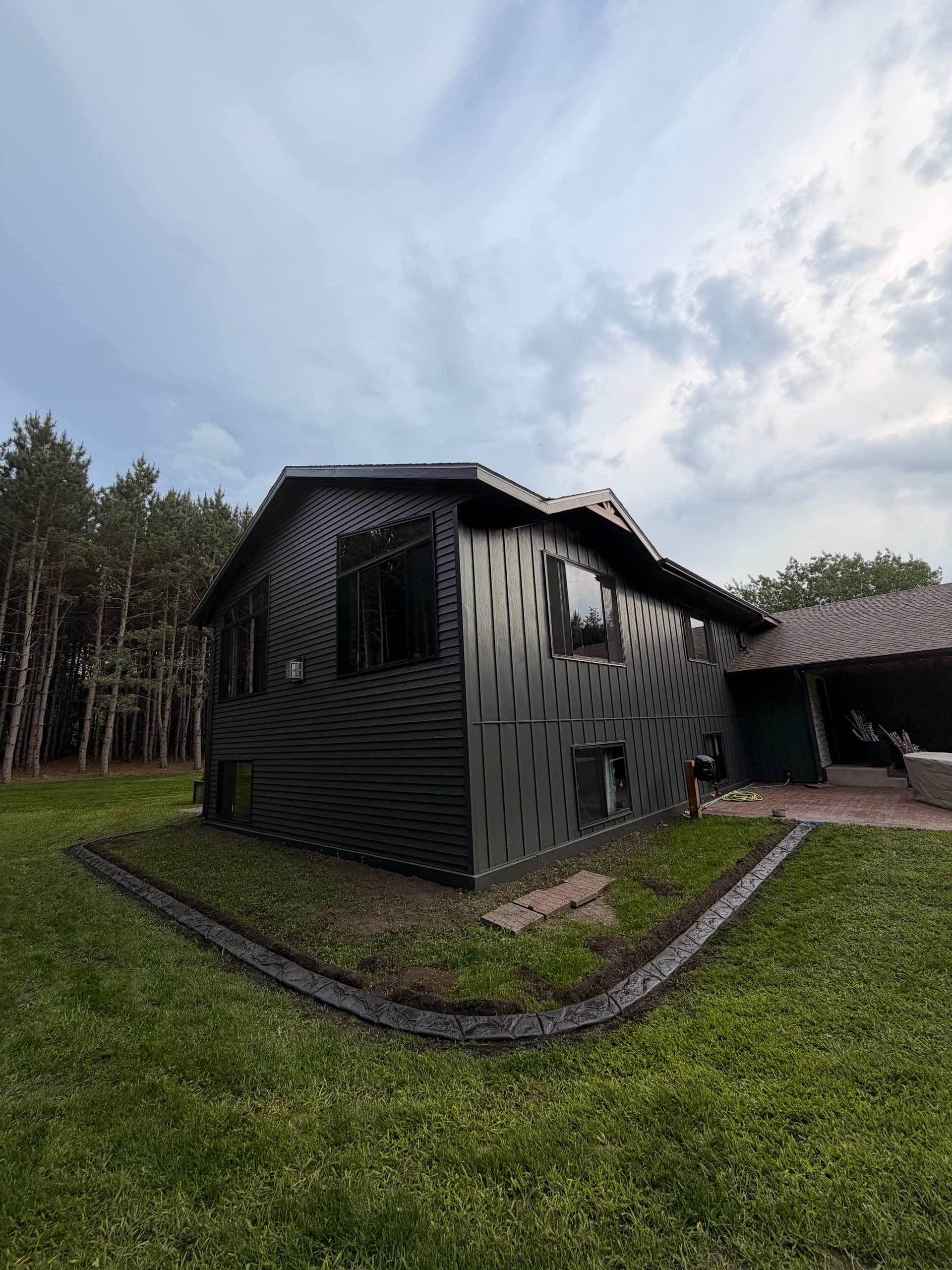 Concrete Curbing with a Storm Grey and Charcoal Blend in Duelm image