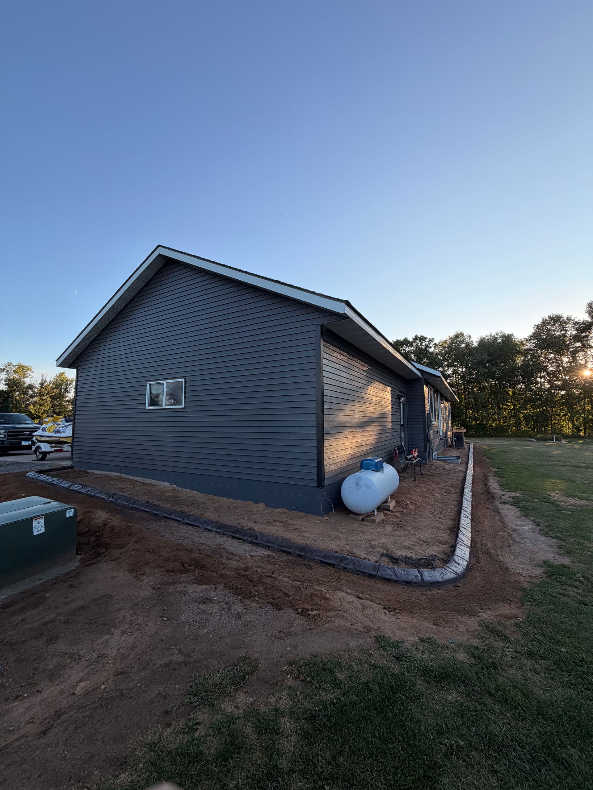 Gallery photos for Concrete Curbing Wraps a Pierz Minnesota Property With Clean Edges: Image #2