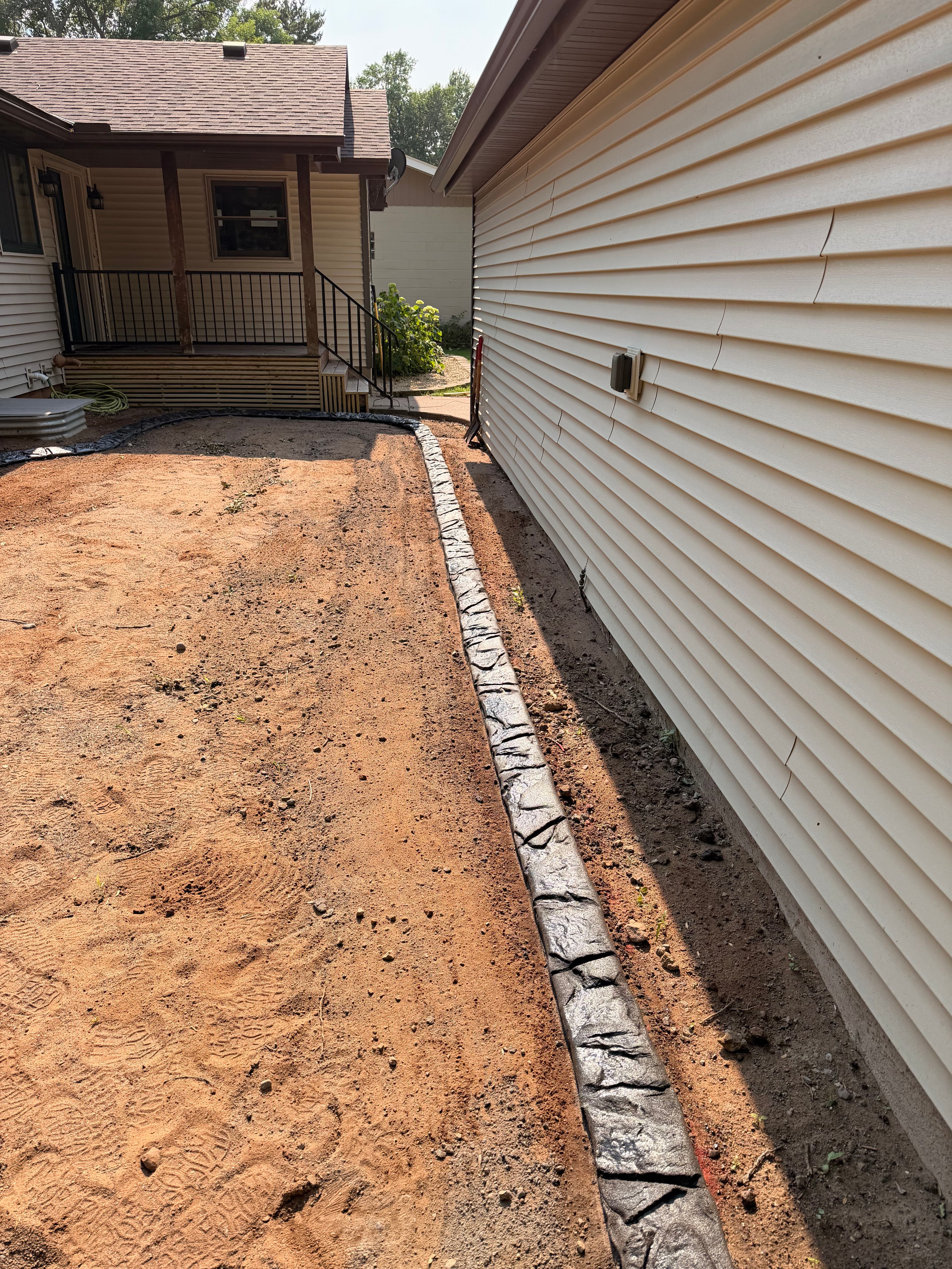 Project Custom Concrete Curbing with a Mississippi Boulder Stamp in Rush City image