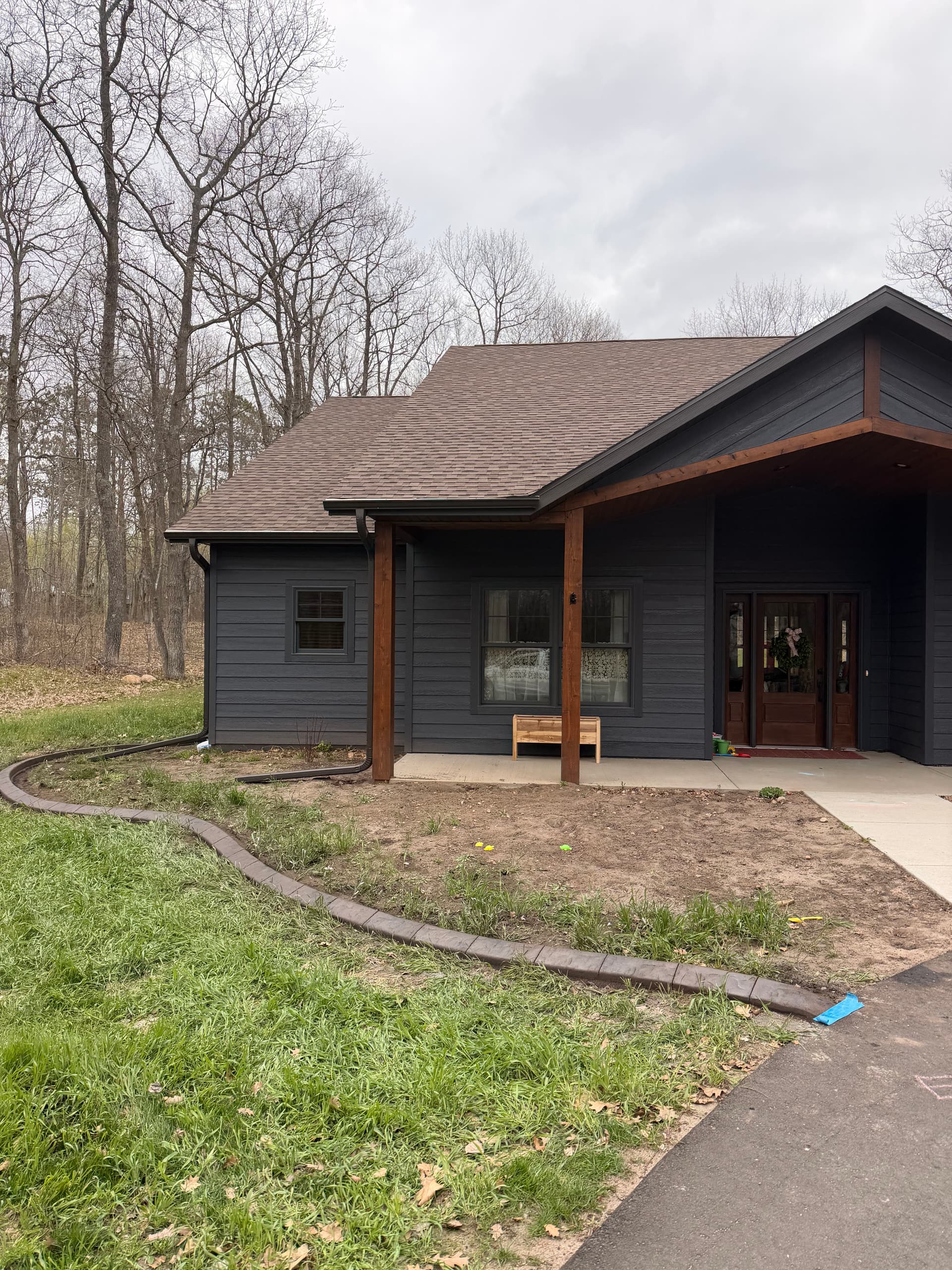 Stamped Concrete Curb Wraps This Crosby Home Clean image