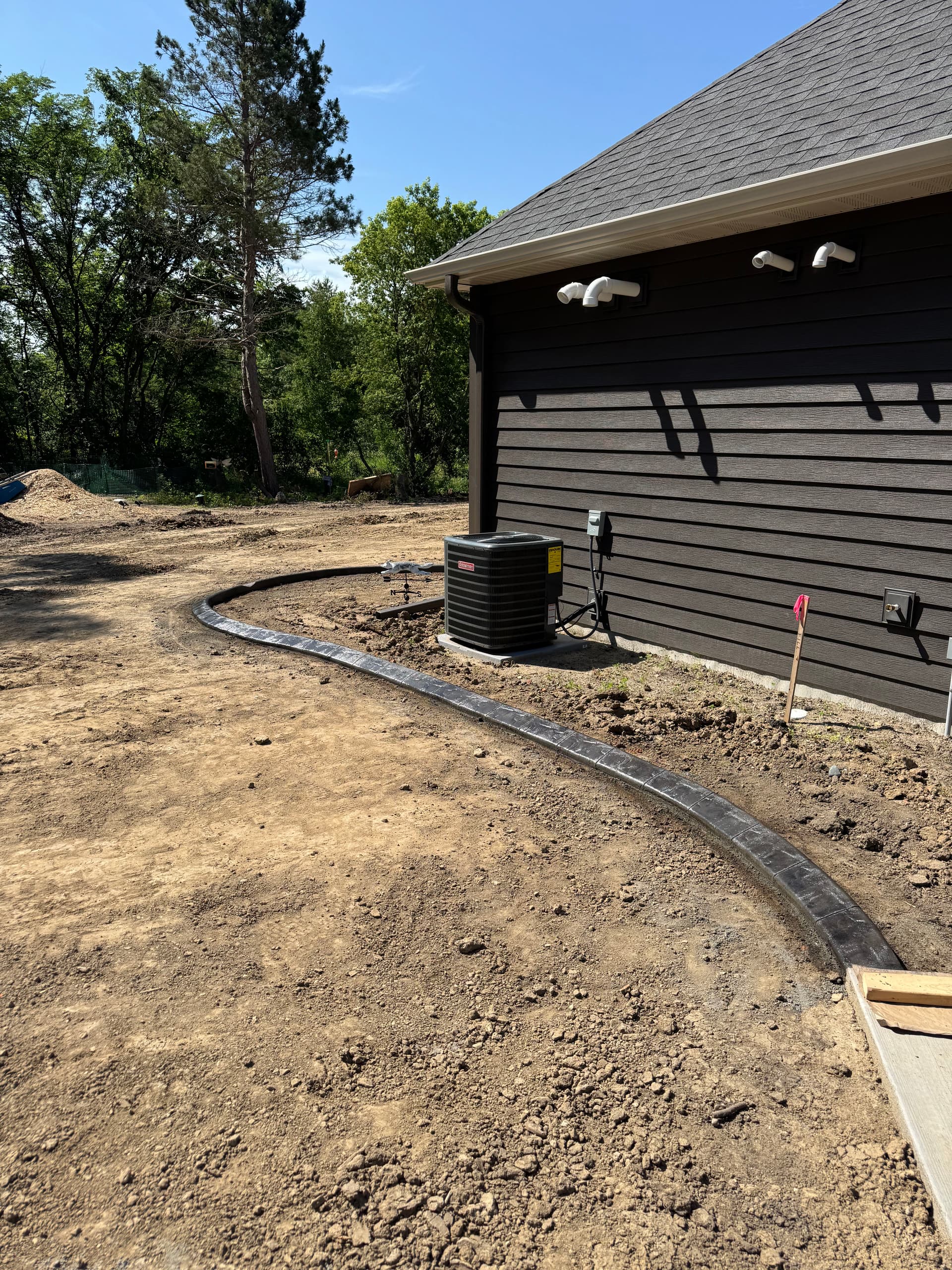 Gallery photos for Concrete Curbing With a Deep Charcoal Slate Stamp in Rogers: Image #2