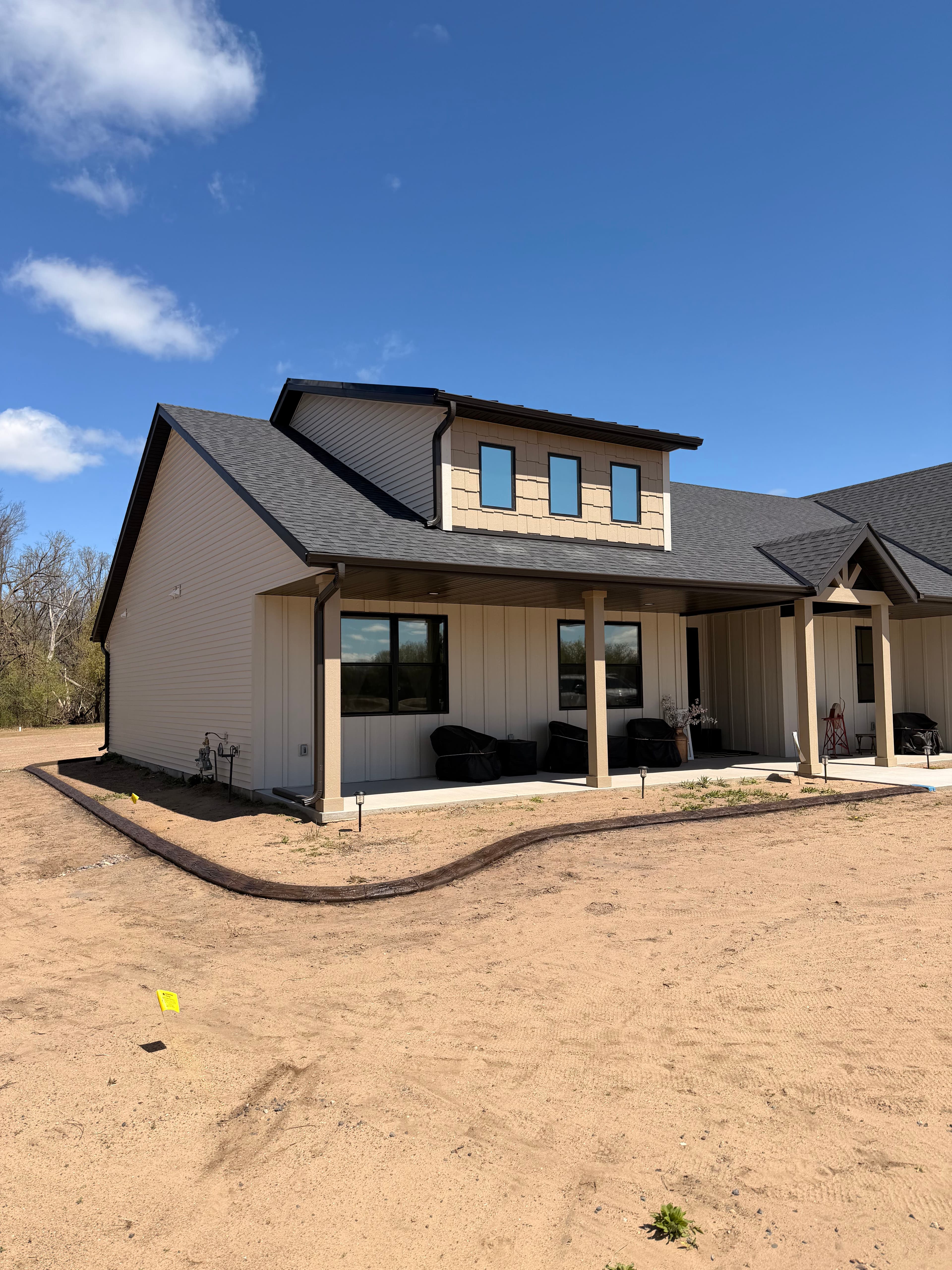 Project Knotty Timber and Walnut Concrete Curbing on a Fresh New Build image
