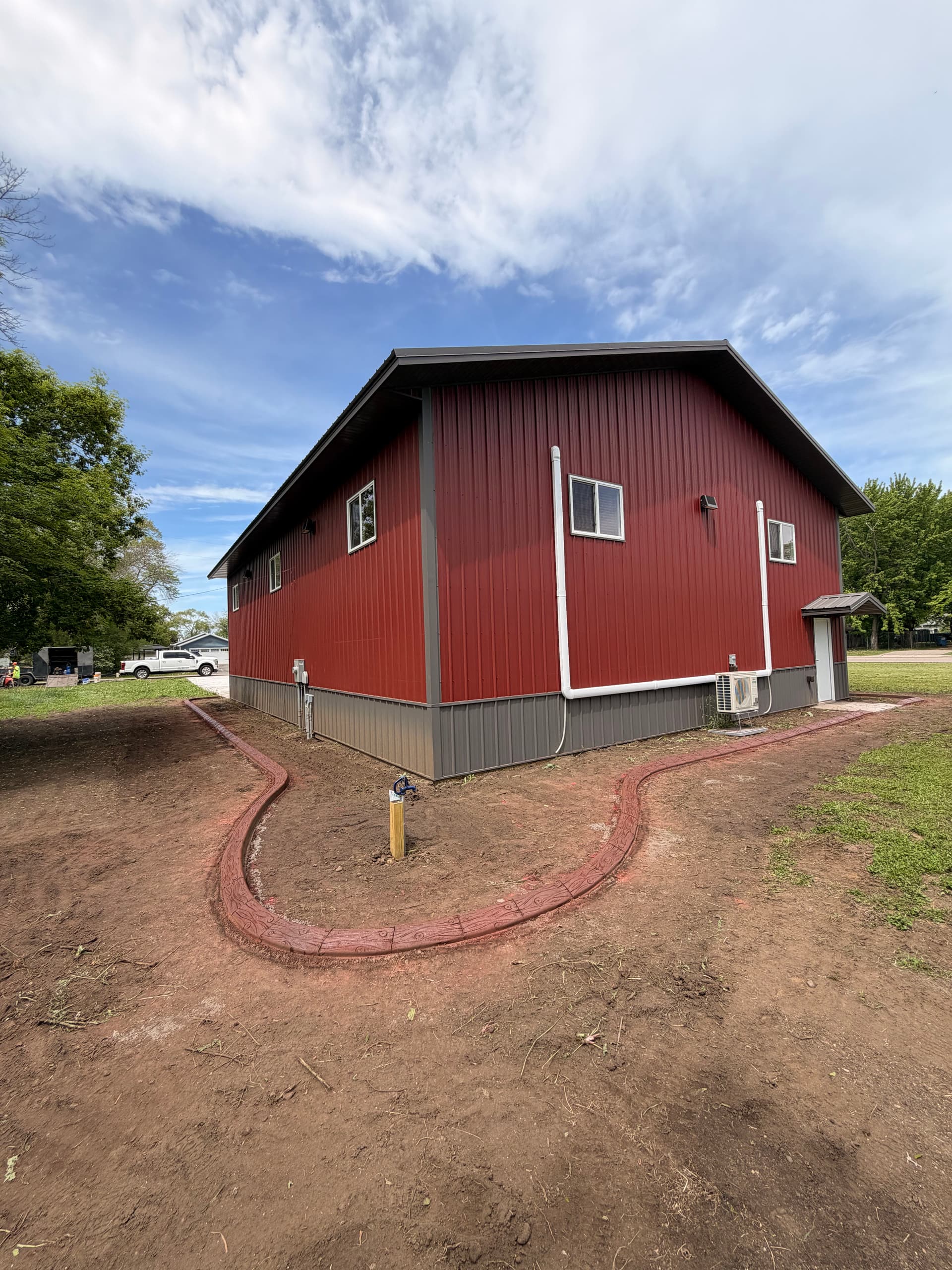 Gallery photos for Stamped Concrete Curbing Wraps a Building in Fairhaven MN: Image #2