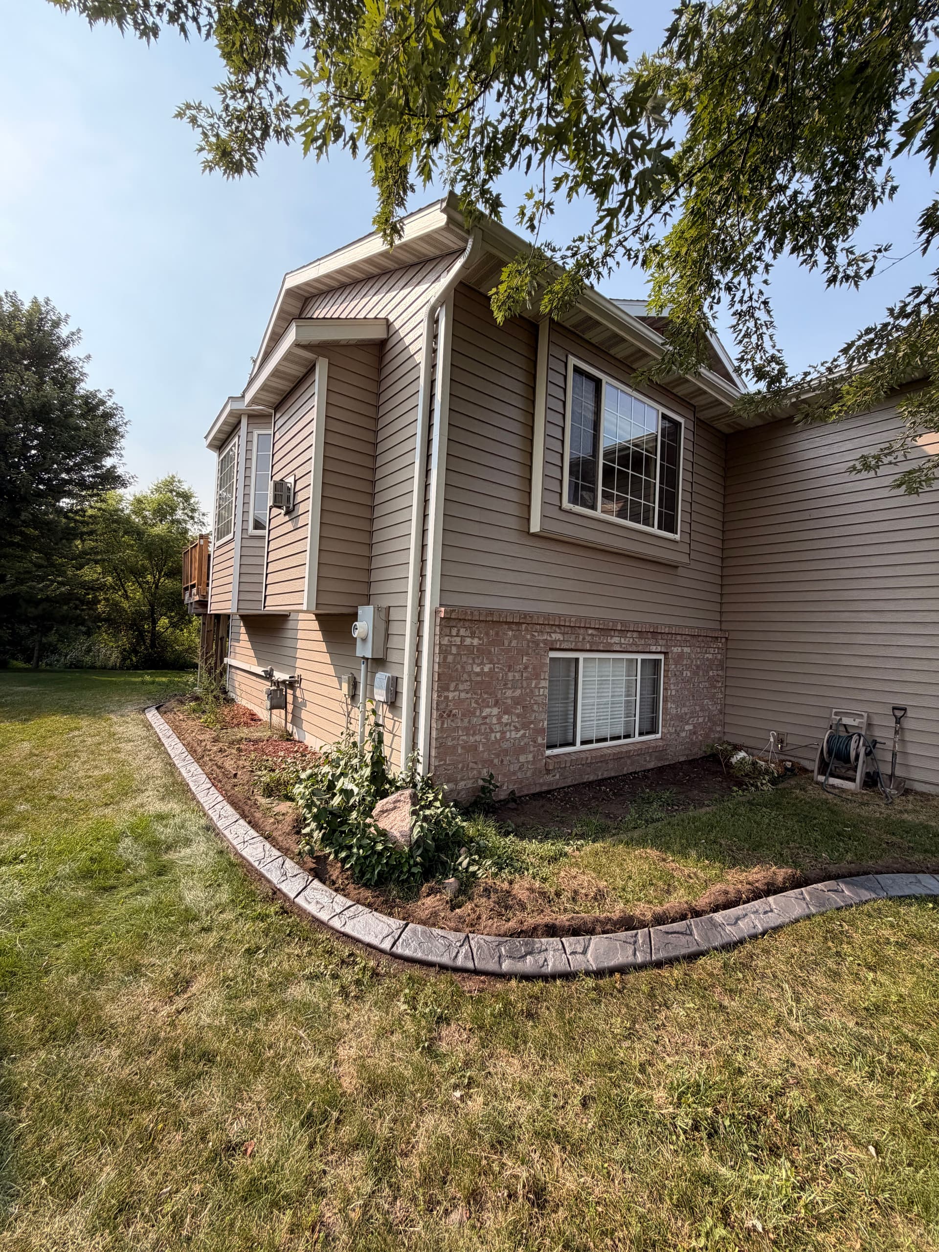 Gallery photos for Concrete Curbing in Sauk Rapids Keeps Beds Sharp and Low Maintenance: Image #1
