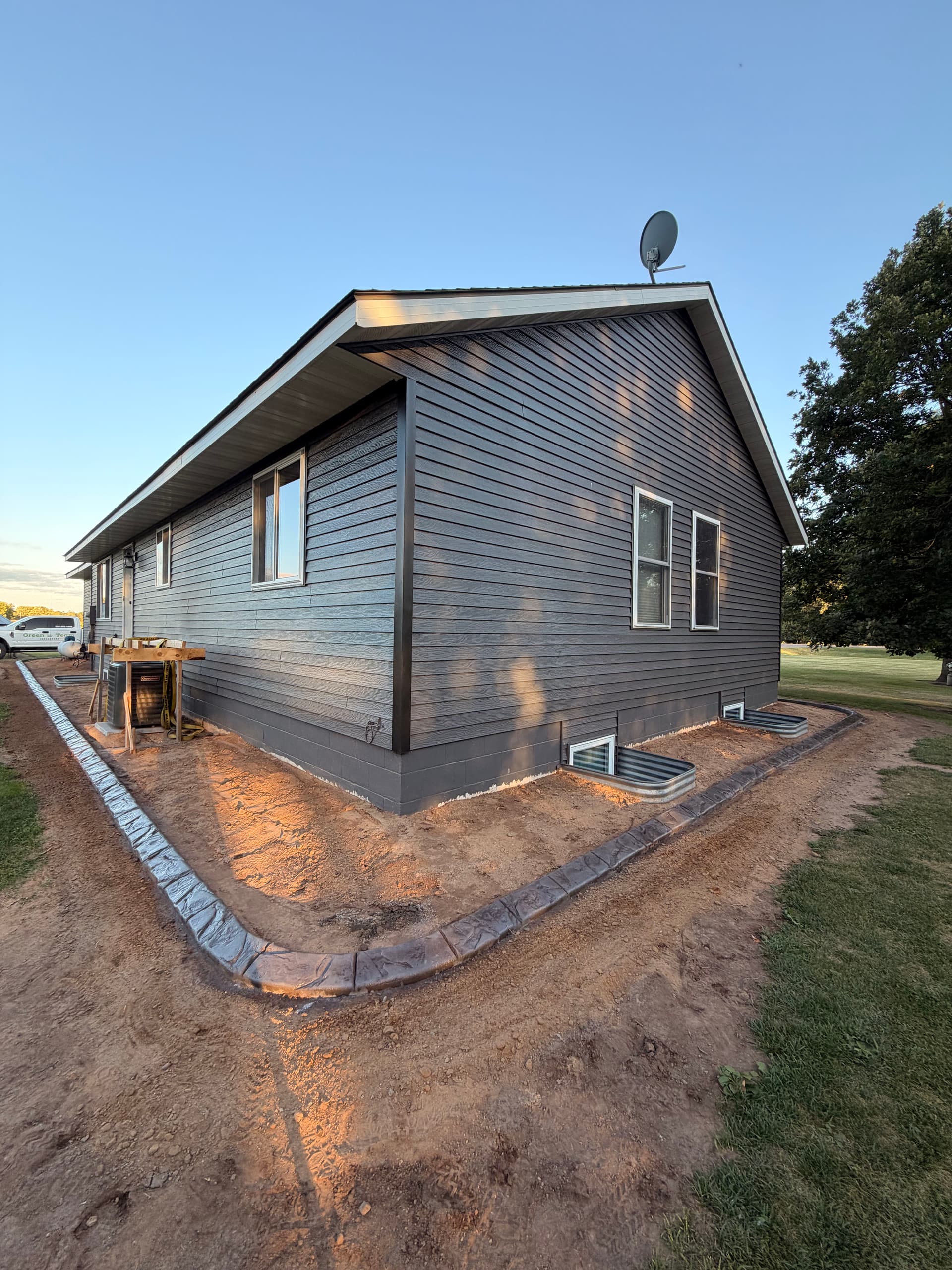 Gallery photos for Concrete Curbing Wraps a Pierz Minnesota Property With Clean Edges: Image #1