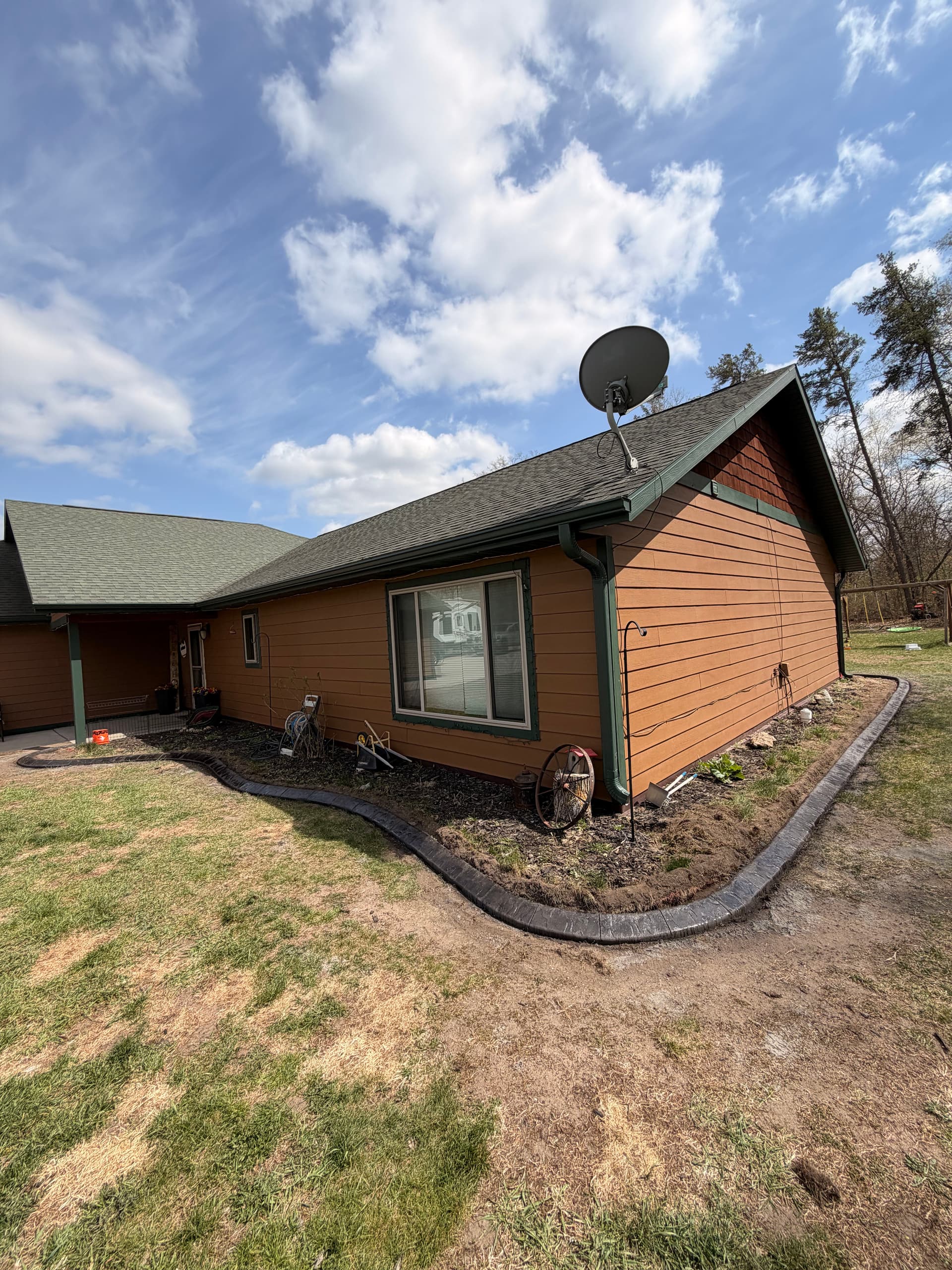 Charcoal Concrete Curbing Replaces Boulder Edging in Motley MN image