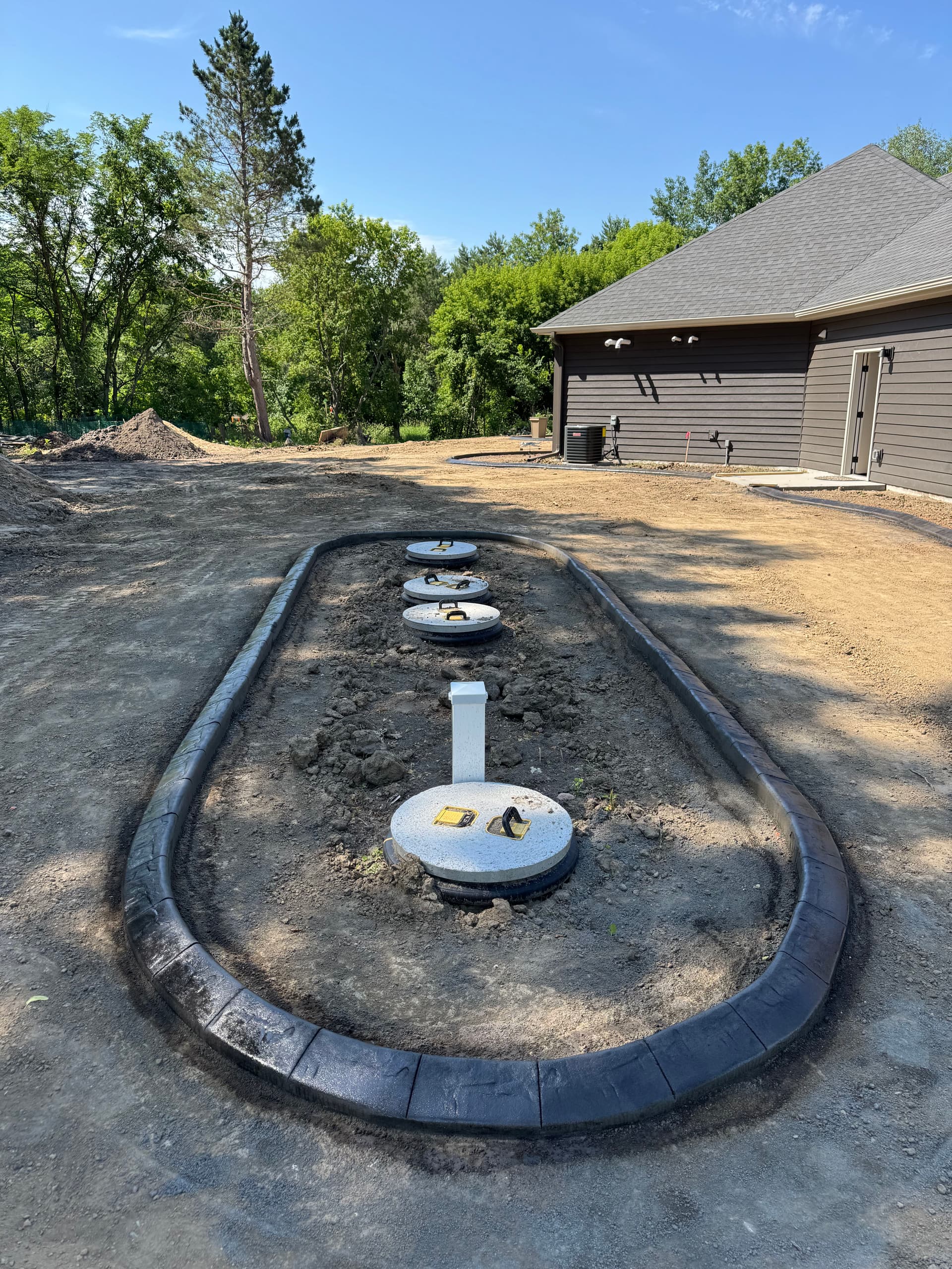 Gallery photos for Concrete Curbing With a Deep Charcoal Slate Stamp in Rogers: Image #1