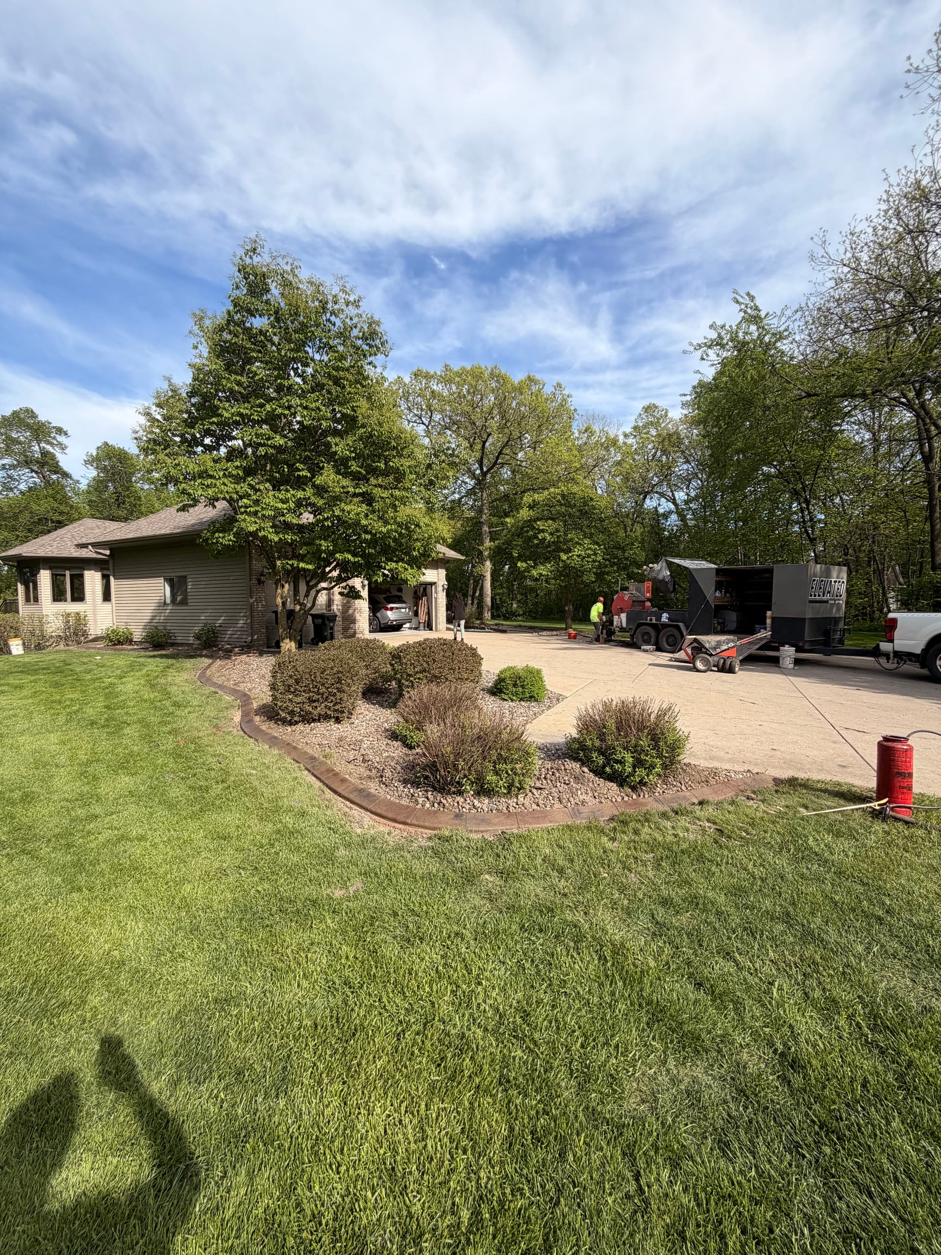 Gallery photos for Stamped Concrete Curbing with Custom Downspout Pads Upgrades Curb Appeal: Image #1
