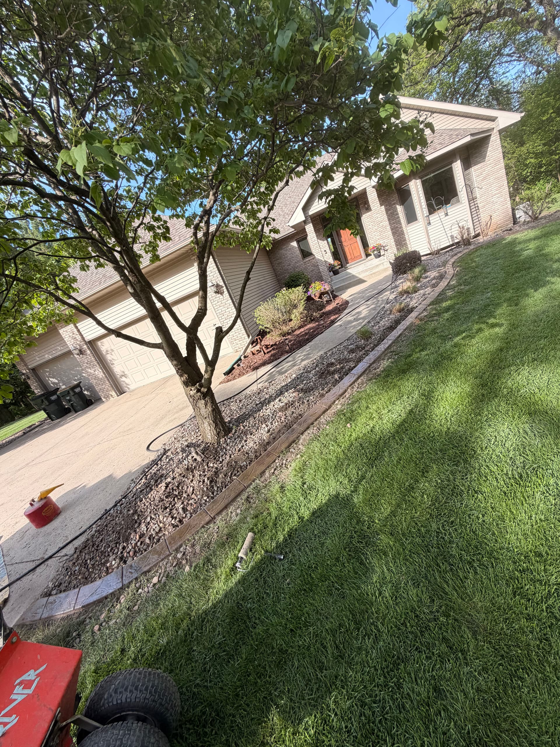 Gallery photos for Stamped Concrete Curbing with Custom Downspout Pads Upgrades Curb Appeal: Image #8