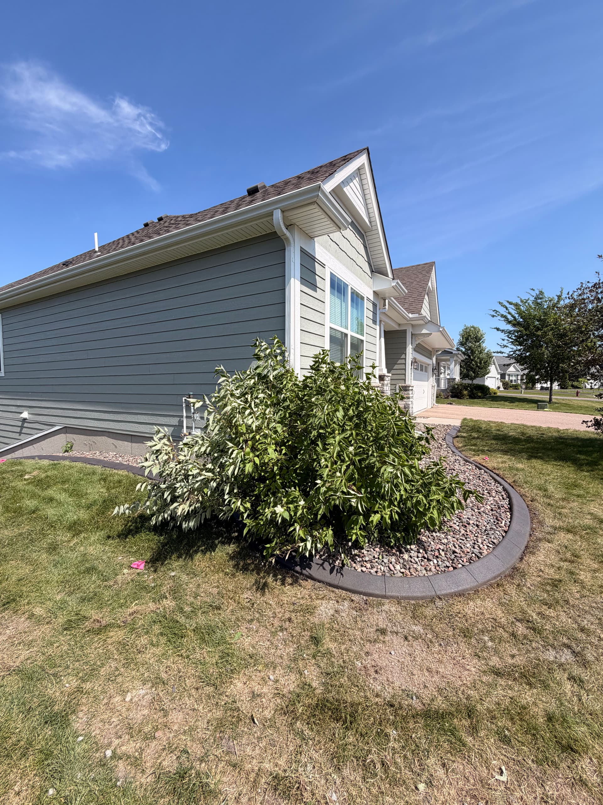 Gallery photos for Charcoal Concrete Curbing Gives Maple Grove Home Sharp Edges: Image #1