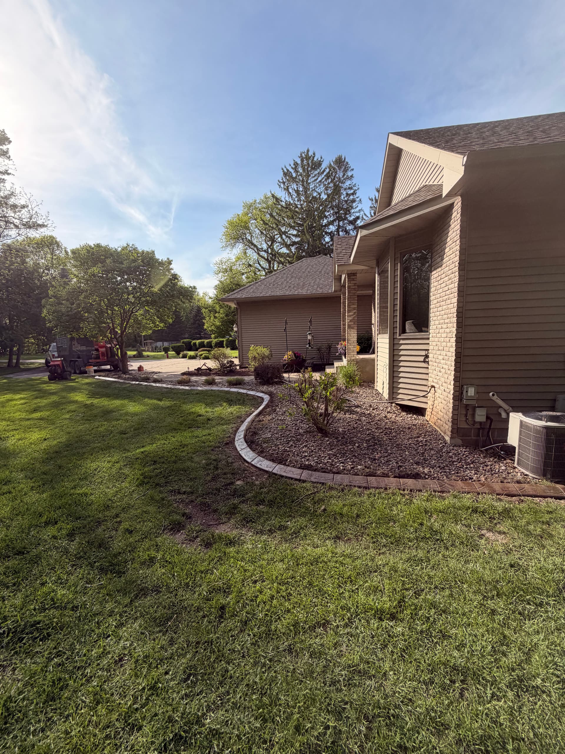 Gallery photos for Stamped Concrete Curbing with Custom Downspout Pads Upgrades Curb Appeal: Image #9