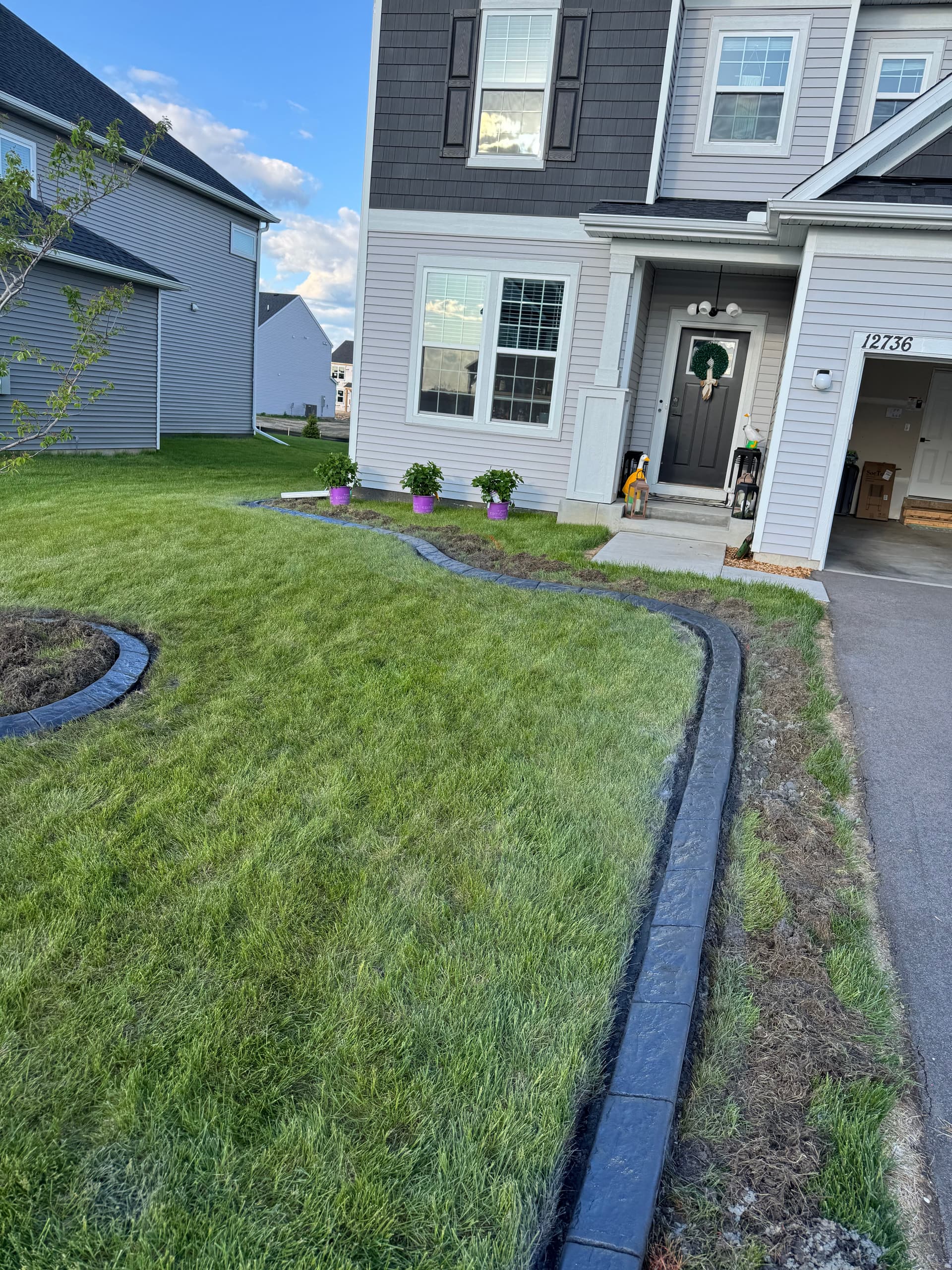 Charcoal Concrete Curbing with Spanish Stamp in Rogers image