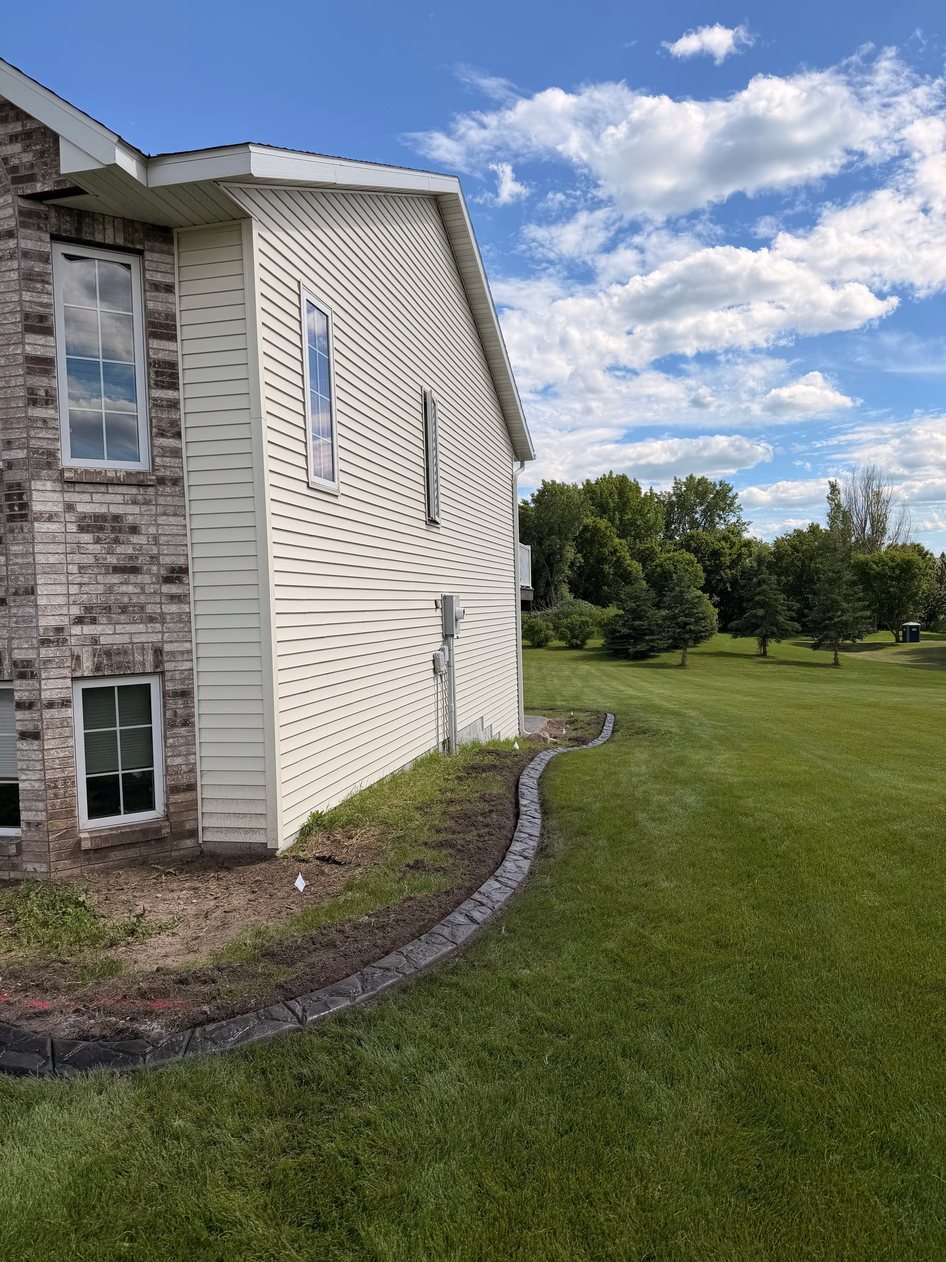 Gallery photos for Concrete Curbing with Granite Slate Stamp in Albany MN: Image #1