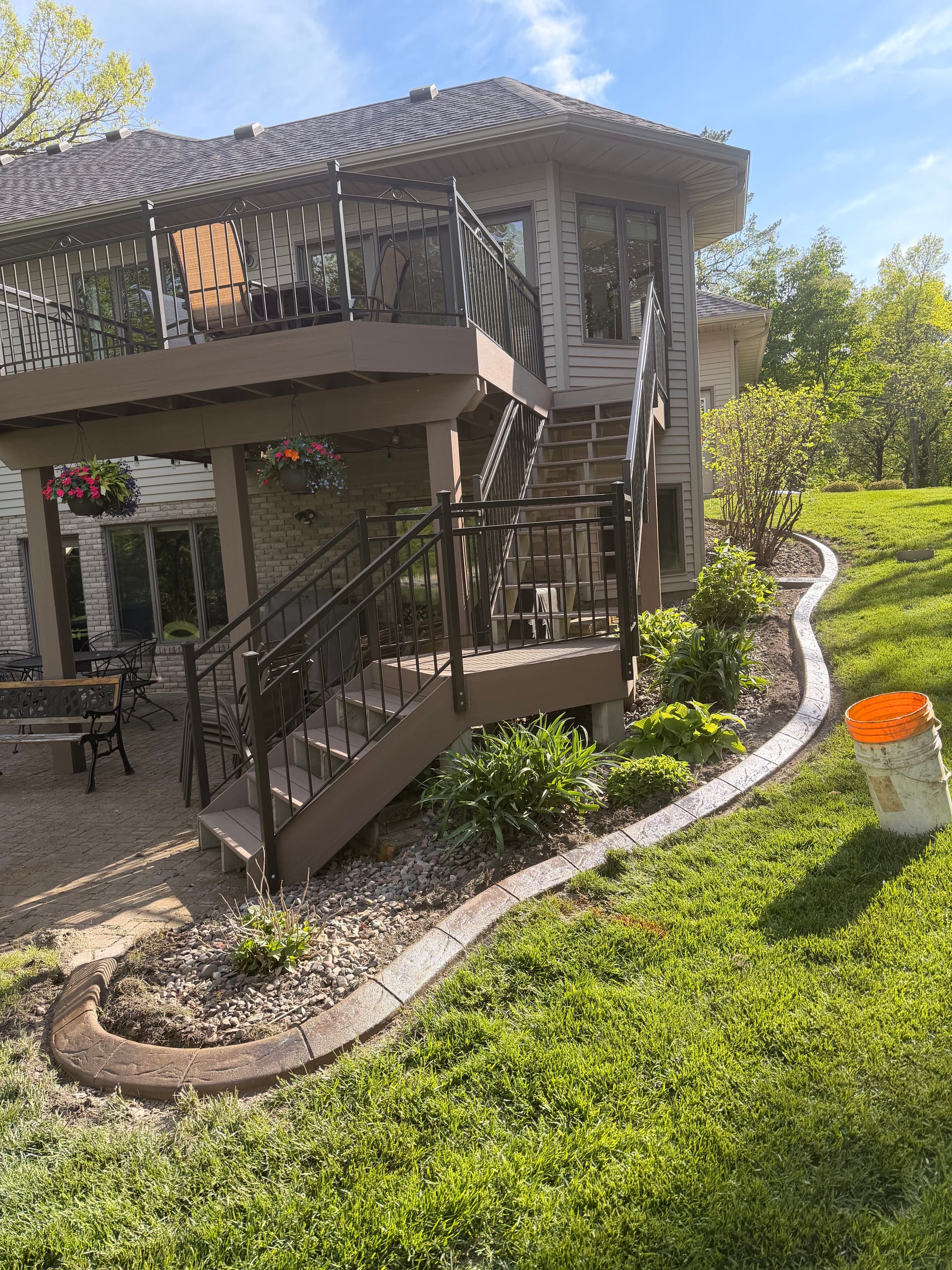 Gallery photos for Stamped Concrete Curbing with Custom Downspout Pads Upgrades Curb Appeal: Image #3