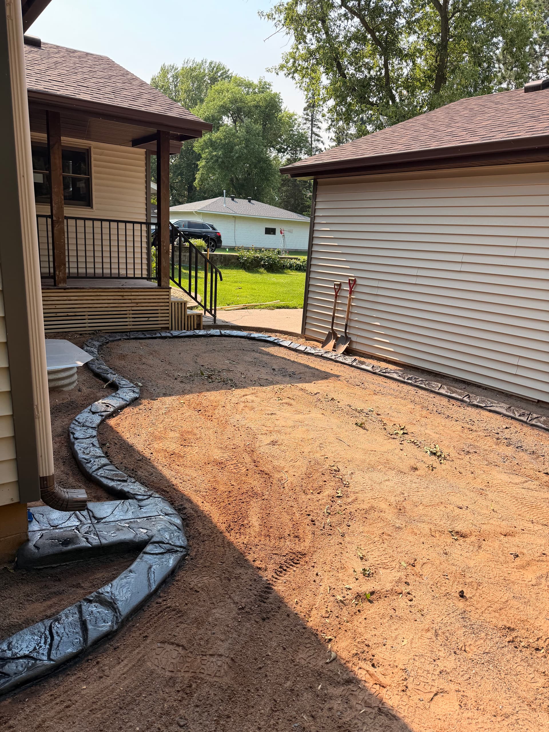 Gallery photos for Custom Concrete Curbing with a Mississippi Boulder Stamp in Rush City: Image #1