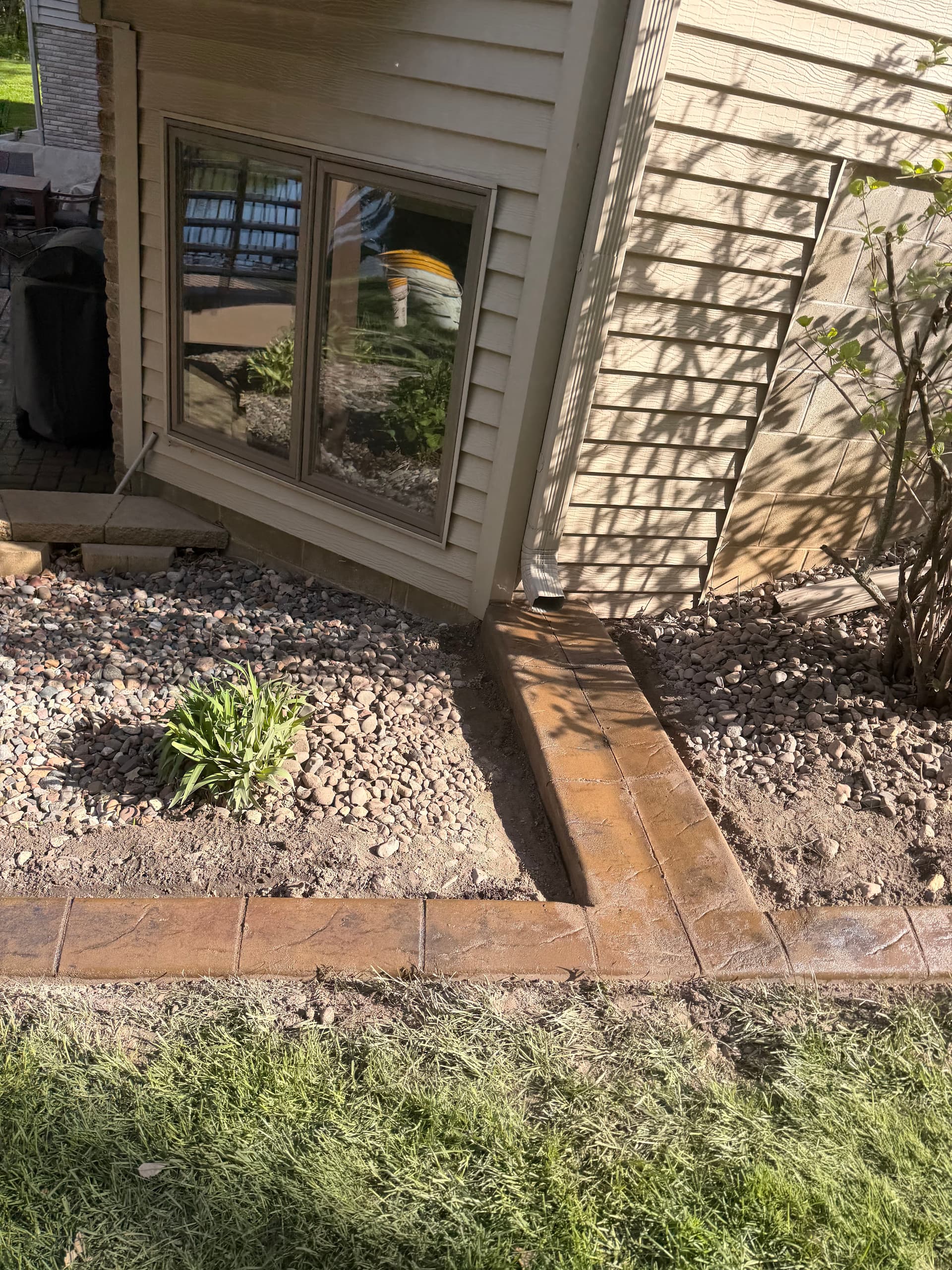 Gallery photos for Stamped Concrete Curbing with Custom Downspout Pads Upgrades Curb Appeal: Image #5